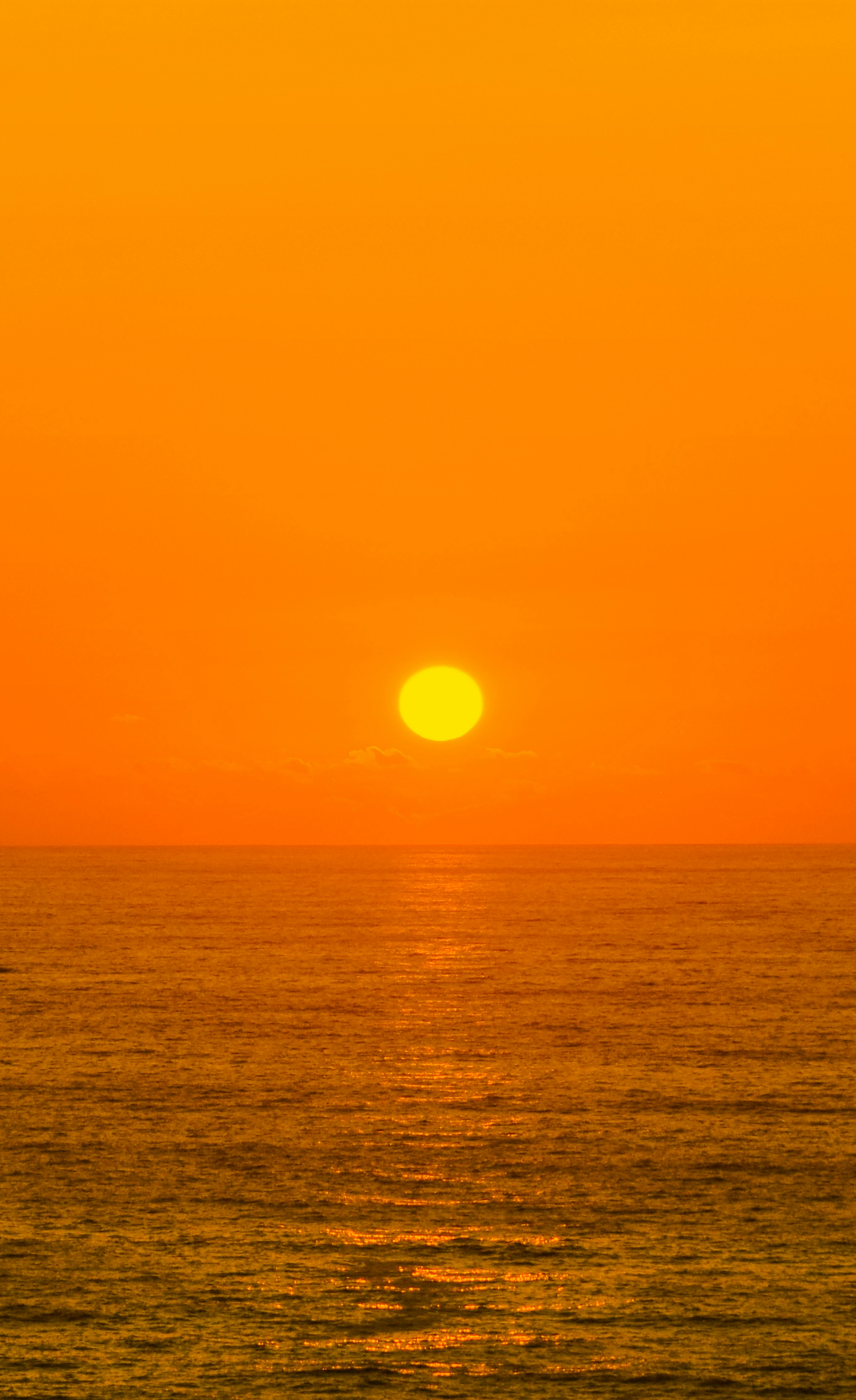 body of water during sunset